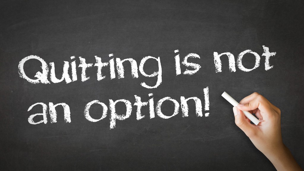 A person drawing and pointing at a Quitting is not an Option Chalk Illustration